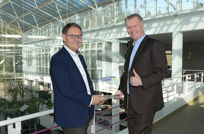 Rolf Völkle (pictured left), Managing Director of ROVO, receives the Ergonomics Innovation Award 2019 from the First Chairman of the IGR, Christian Brunner.